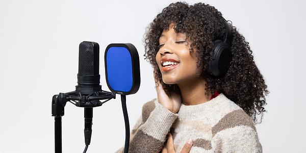 Vocalist recording with an Audio Icon pop filter